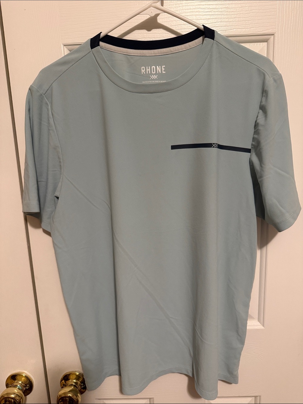 RHONE Men’s Light Blue Short Sleeve Performance Tee with Navy Accents